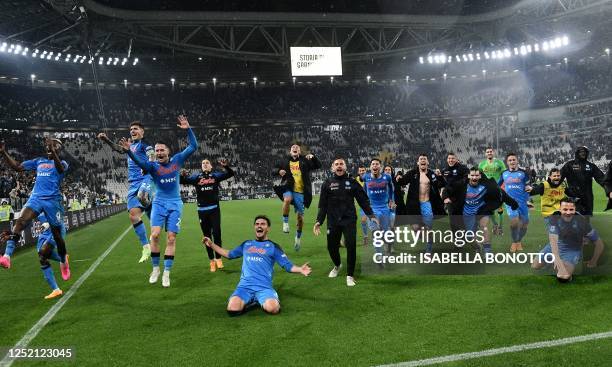 Napoli's players celebrate after winning in the Italian Serie A football match between Juventus and Napoli on April 23, 2023 at the Juventus stadium...