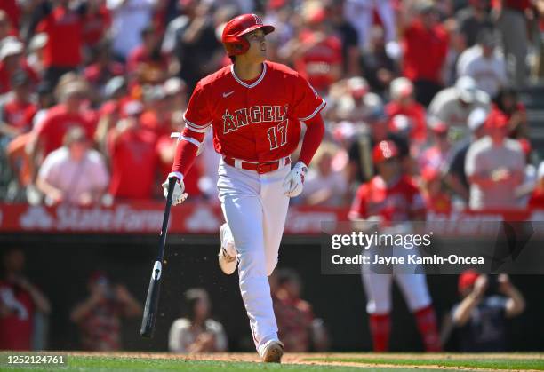 Shohei Ohtani of the Los Angeles Angels watches the flight of the ball on a solo home run in the sixth inning against the Kansas City Royals at Angel...