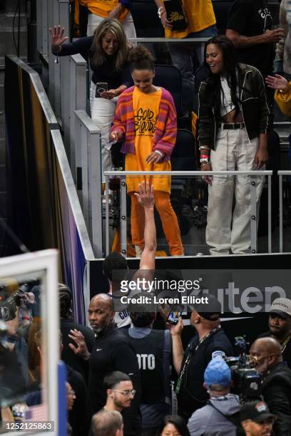 Stephen Curry of the Golden State Warriors greets daughter Riley Curry and wife Ayesha Curry after defeating the Sacramento Kings in Game Four of the...