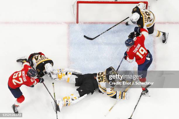 Goaltender Linus Ullmark of the Boston Bruins defends the net against Matthew Tkachuk of the Florida Panthers in Game Four of the First Round of the...