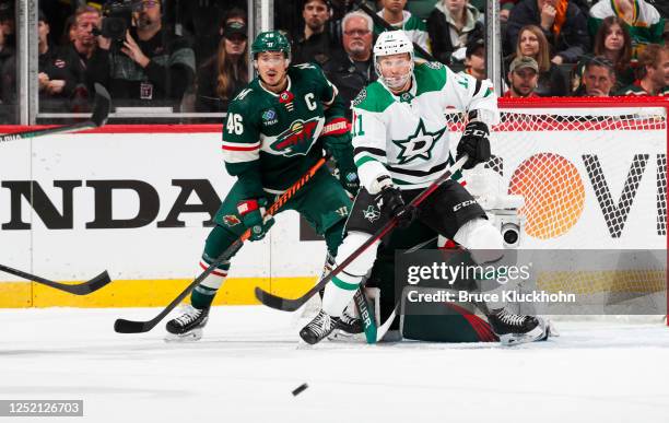 Jared Spurgeon of the Minnesota Wild and Luke Glendening of the Dallas Stars look on in the first period of Game Four of the First Round of the 2023...