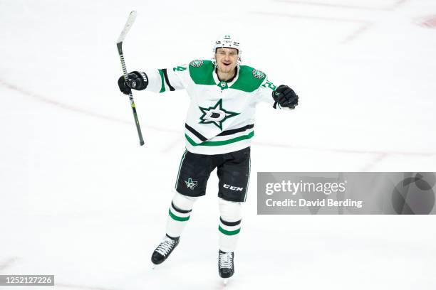 Roope Hintz of the Dallas Stars celebrates a power play goal by teammate Tyler Seguin against the Minnesota Wild in the third period of Game Four of...