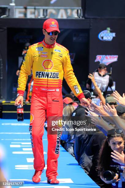 Joey Logano shakes hands with fans during diver introductions prior to the running of the NASCAR Cup Series GEICO 500 on April 23, 2023 at Talladega...