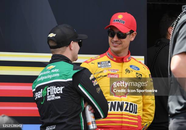 Joey Logano talks to Justin Haley before the running of the NASCAR Cup Series Geico 500 on April 23 at Talladega Superspeedway in Talladega, AL.