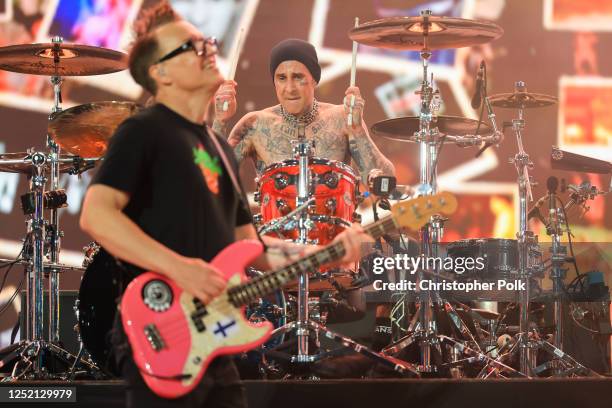 Mark Hoppus and Travis Barker of Blink-182 perform onstage at the 2023 Coachella Valley Music & Arts Festival on April 23, 2023 in Indio, California.