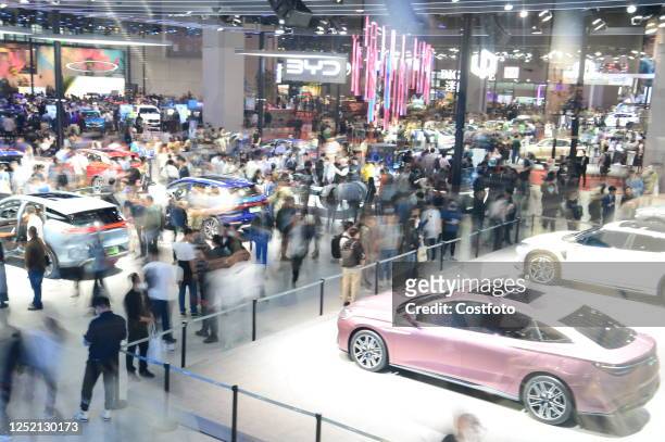 Crowd gathers at the stand of Chinese brand BYD at the 2023 Shanghai Auto Show in Shanghai, China, April 21, 2023. In addition to the much-watched...
