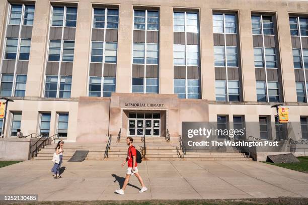 Eli Tsarovsky graduate student in the Public Health and Public Affairs program, walks on the University of Wisconsin-Madison campus Library Mall,...