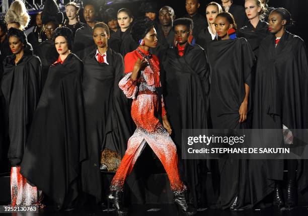 Models showcase creations from designer David Thale on February 19, 2011 on the Nelson Mandela Bridge during the Africa Fashion week in the city of...