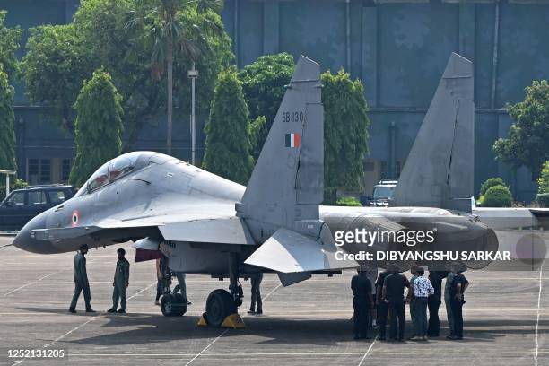 The Indian Air Force personnel stand beside Sukhoi Su-30 fighter jet during the joint 'Exercise Cope India 2023' between The United States Air Force...