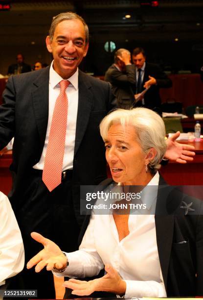 Cypriot Finance minister Charilaos Stavrakis talks with French Economy Minister Christine Lagarde before an Economy and Finance Council meeting on...