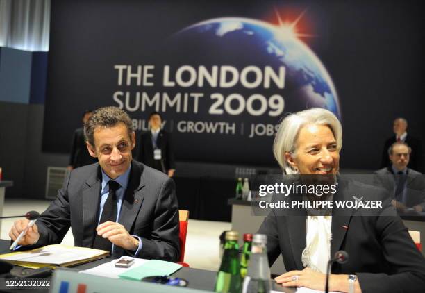 French President Nicolas Sarkozy and French Finance Minister Christine Lagarde take part in a round table meeting at the ExCel centre in east London...