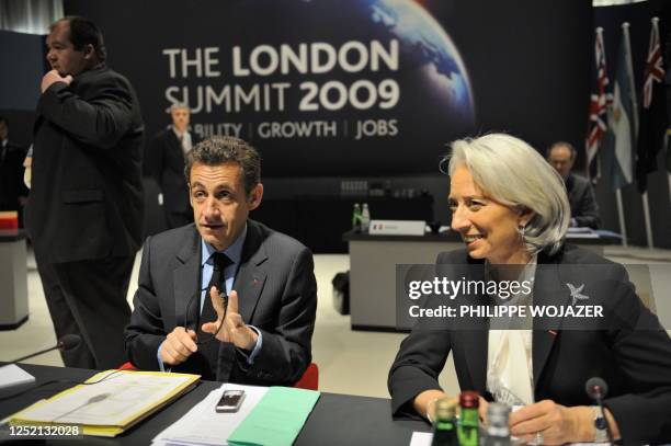 French President Nicolas Sarkozy and French Finance Minister Christine Lagarde take part in a round table meeting at the ExCel centre in east London...