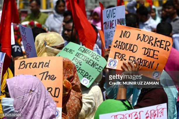 Victims of the Rana Plaza garments factory tragedy take part in a protest on its 10th anniversary at the site where the building once stood in Savar...