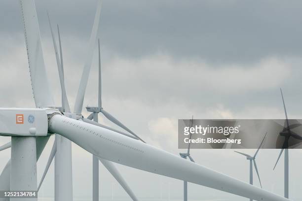 The logos of CEZ AS and General Electric Co. On the nacelle of a wind turbine at the Fantanele-Cogealac wind farm, operated by CEZ group, in...