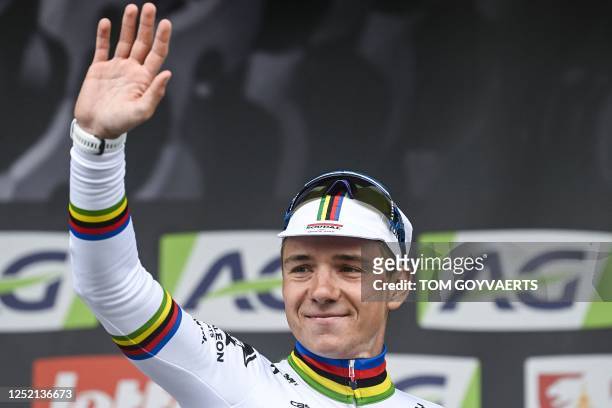 Soudal Quick-Step's Belgian rider Remco Evenepoel celebrates on the podium after winning the men's elite race of the Liege-Bastogne-Liege one day...