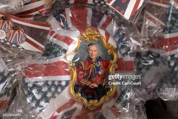 Commemorative King Charles III Coronation hat is displayed for sale at a souvenir shop on April 24, 2023 in London, England. The Coronation of King...