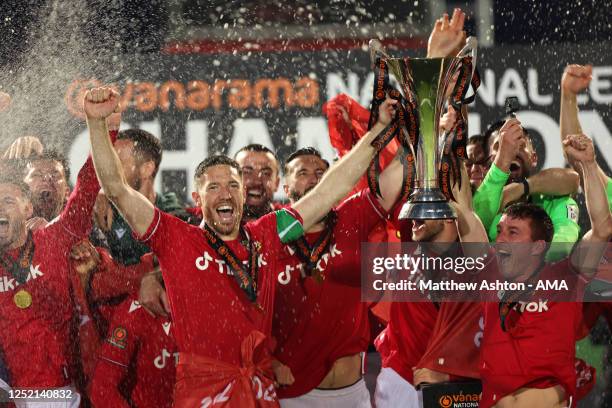 Ben Tozer and Luke Young of Wrexham lift the Vanarama National League Trophy as Wrexham celebrate promotion back to the English Football League...