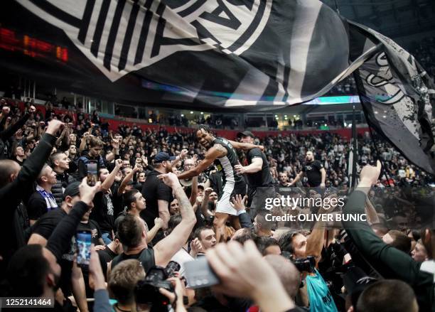 Partizan's American-born Serbian captain Kevin Punter celebrates with fans after winning the EuroLeague basketball match between KK Partizan Belgrade...