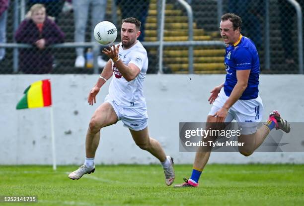 Carlow , Ireland - 23 April 2023; Ben McCormack of Kildare in action against Paul McLoughlin of Wicklow during the Leinster GAA Football Senior...