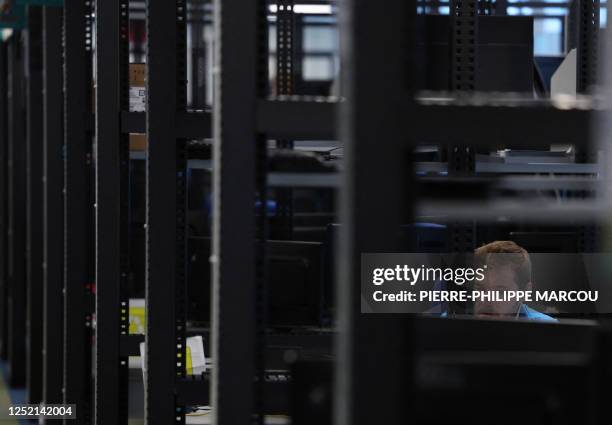 An employee of the European multinational information technology service and consulting company, Atos, is pictured at the company's cybersecurity...
