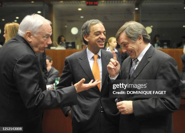 Luxembourg Finance Minister Jeannot Krecke talks with the president of the European Bank of Investment, Philippe Maystadt and Cypriot Finance...