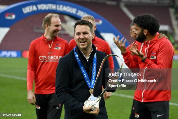 Alkmaar manager Jan Sierksma celebrates with the trophy after the UEFA Youth League 2022/23 final match between AZ Alkmaar and HNK Hajduk Split at...