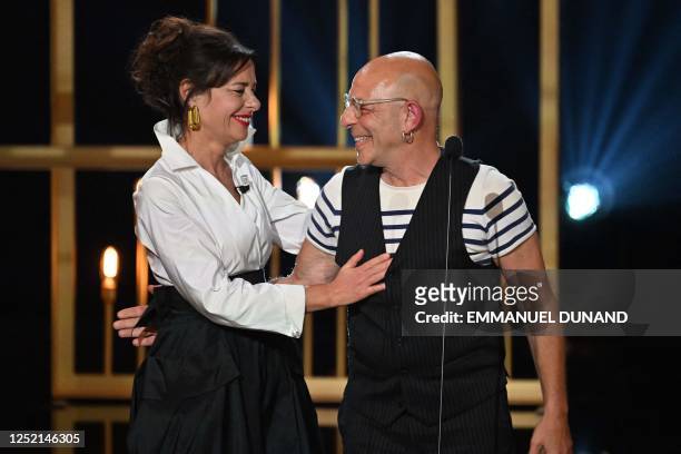 French theatre director Christian Hecq is congratulated by his wife, French theatre director Valerie Lesort after he received the Moliere of Best...