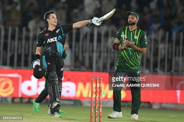 New Zealand's Mark Chapman celebrates after scoring a century during the fifth and final Twenty20 international cricket match between Pakistan and...