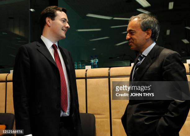British Chancellor of the Exchequer George Osborne speaks with Cyprus' Charilaos Stavrakis before a Economy Task Force meeting at the EU headquarters...