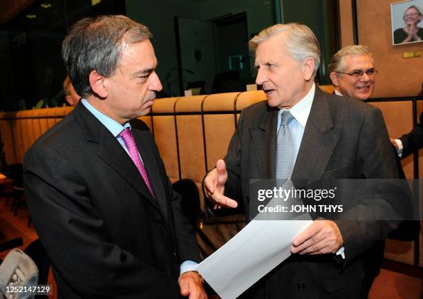 European Central Bank chief Jean-Claude Trichet speaks with Cyprus' Finance minister Charilaos Stavrakis on May 4, 2009 before an Eurogroup meeting...