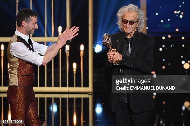 Canadian producer and song writer Luc Plamondon is applauded by French actor and opera and theatre director Thomas Jolly as he receives the Moliere...