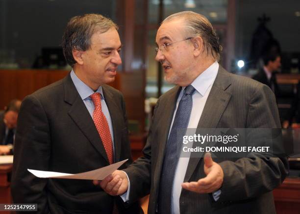 Cypriot Finance Minister Charilaos Stavrakis listens to his Spanish counterpart Pedro Solbes on March 10, 2009 before an Economy and Finance Council...