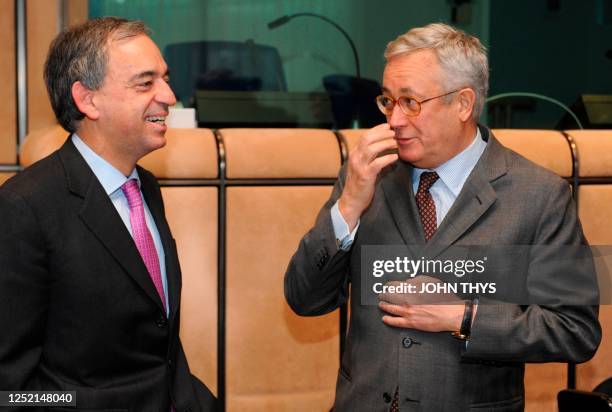 Finance minister of Cyprus Charilaos Stavrakis smiles as he stands with Italian Finance Minister Giulio Tremonti on May 4, 2009 before a Eurogroup...