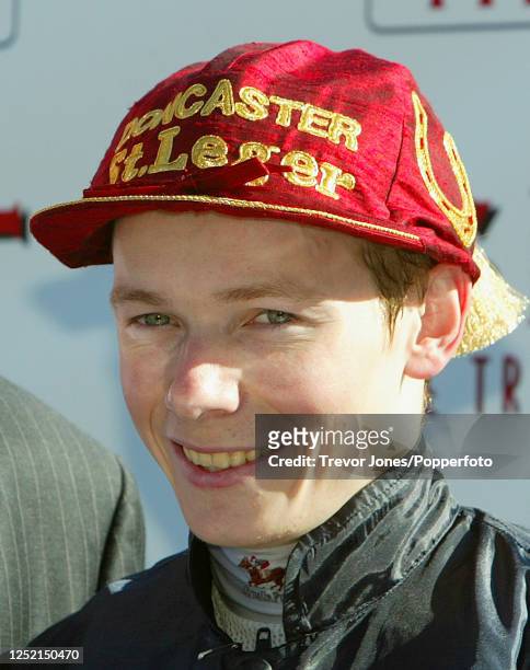 Irish Jockey Jamie Spencer wearing the ceremonial cap after winning the St Leger riding Brian Boru at Doncaster, 13th September 2003.