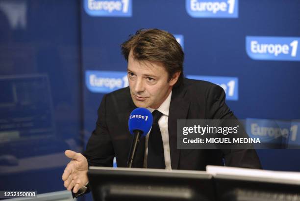 New French Finance Minister Francois Baroin speaks in a studio of French Europe 1 radio on July 6, 2011 in Paris during his first interview since his...