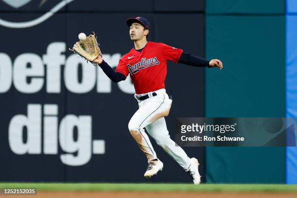 Steven Kwan of the Cleveland Guardians makes a catch to get out Jurickson Profar of the Colorado Rockies during the ninth inning at Progressive Field...