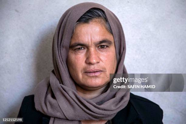 In this picture taken on April 22 Bahar Elias, a 40-year-old displaced Iraqi woman from the Yazidi community, poses for a picture during an interview...