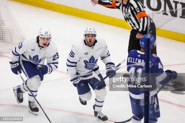 Alexander Kerfoot of the Toronto Maple Leafs celebrates the game winning goal against the Tampa Bay Lightning during overtime in Game Four of the...