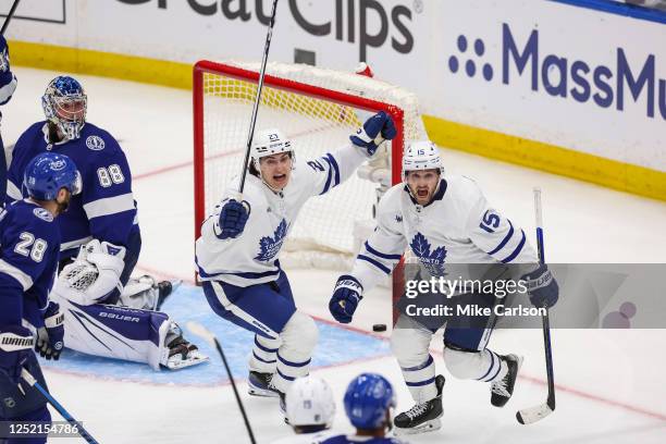 Alexander Kerfoot of the Toronto Maple Leafs celebrates the game winning goal against the Tampa Bay Lightning during overtime in Game Four of the...