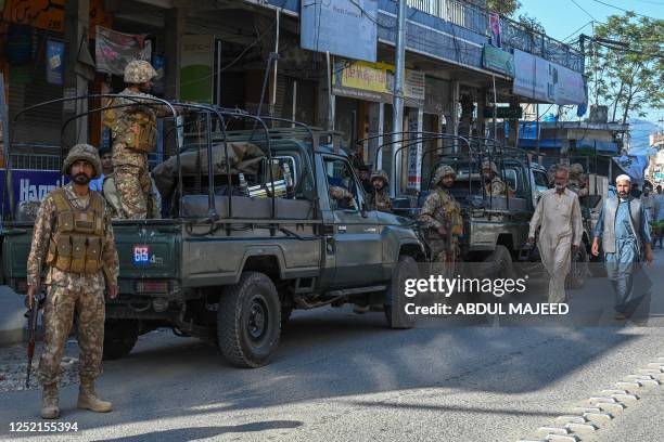 Army troops stand stand guard along a street in Kabal town of Swat Valley in Pakistan's northwestern region of Khyber Pakhtunkhwa province on April...