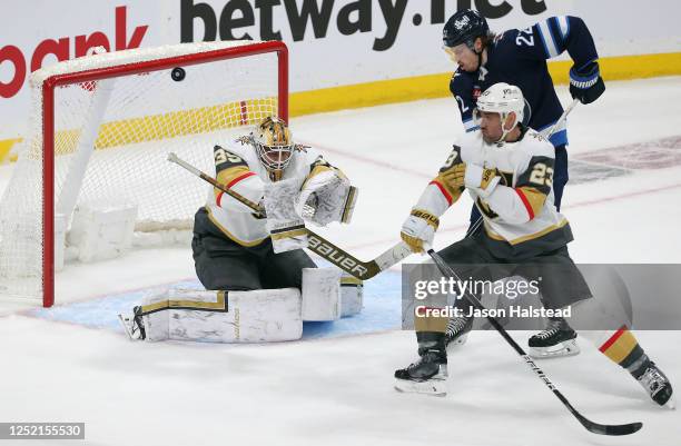 Laurent Brossoit of the Vegas Golden Knights makes a save during action against the Winnipeg Jets in the third period of Game Four of the First Round...