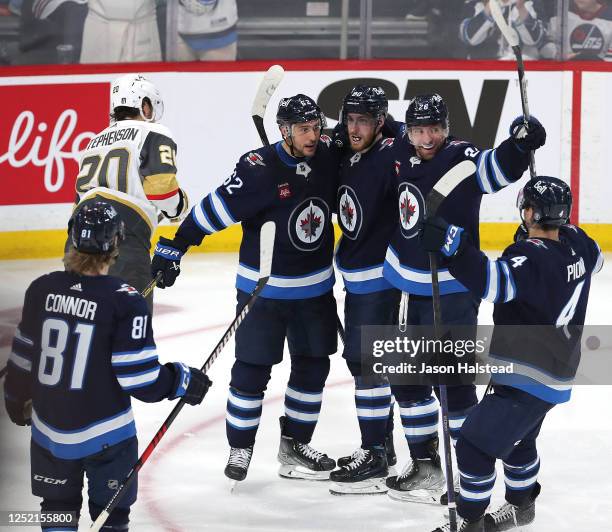 Pierre-Luc Dubois of the Winnipeg Jets celebrates his goal with teammates during action against the Vegas Golden Knights in the third period of Game...