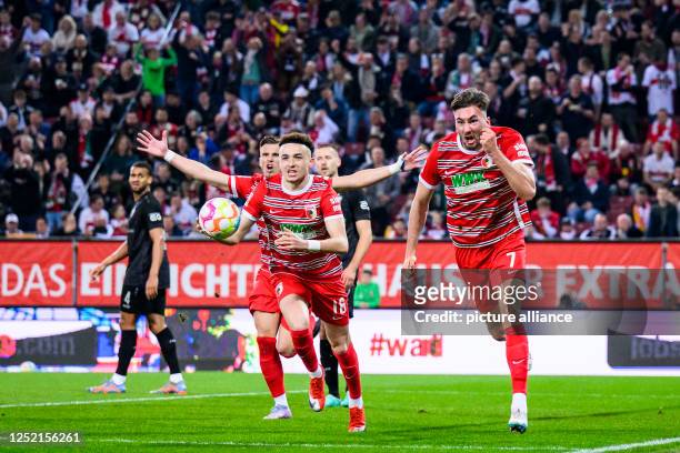 April 2023, Bavaria, Augsburg: Soccer: Bundesliga, FC Augsburg - VfB Stuttgart, Matchday 29, WWK Arena. Augsburg's Dion Beljo celebrates with...