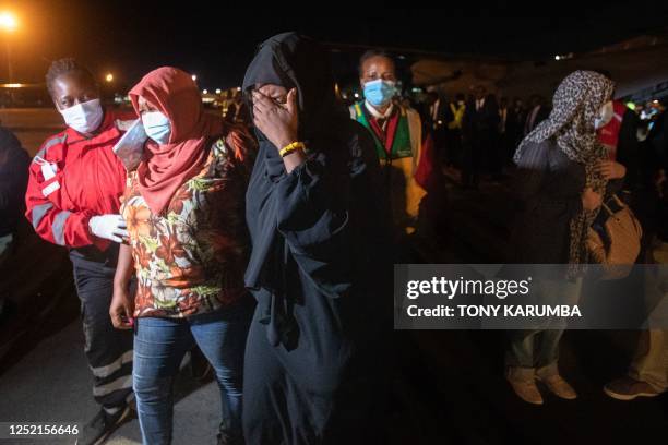 Kenyan and Somalian citizens arrive at the Jomo Kenyatta Airport in Nairobi after being evacuated aboard a Kenya Airforce aircraft to flee the deadly...