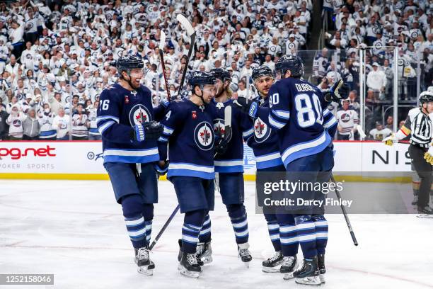 Blake Wheeler, Neal Pionk, Kyle Connor, Nino Niederreiter and Pierre-Luc Dubois of the Winnipeg Jets celebrate a third period goal against the Vegas...
