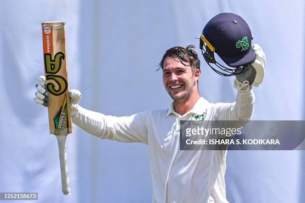 Ireland's Curtis Campher celebrates after scoring a century during the second day of the second and final cricket Test match between Sri Lanka and...