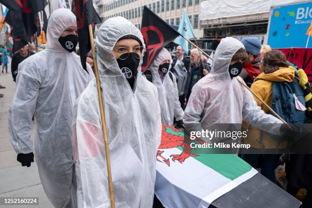 Activists from the environmental group Extinction Rebellion on a 'People's Picket' outside the Department for Energy Security and Net Zero carry a...