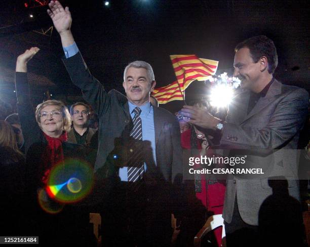 The candidate of the Catalan socialist party , Pascual Maragall , and his wife Diana Garrigosa raise ther hands, and the leader of the Spanish...