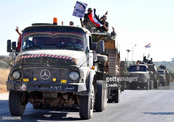 Syrian soldiers withdraw in convoy on August 10 from the city of Hama after a 10-day military operation to quell pro-democracy protests. AFP PHOTO/STR