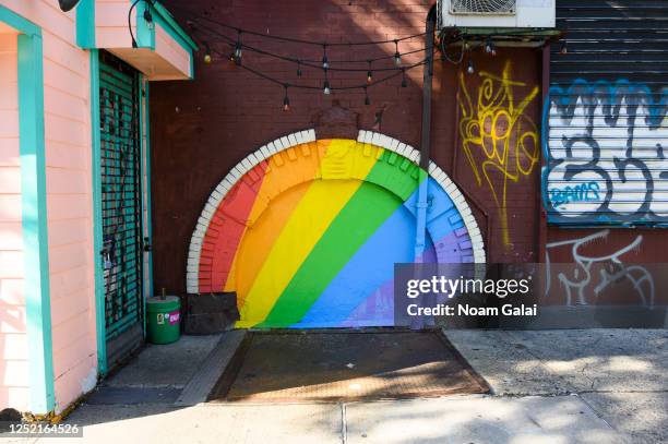 Pride art is displayed outside Juicy Lucy's in the East Village on June 24, 2020 in New York City. Due to the ongoing Coronavirus pandemic, this...